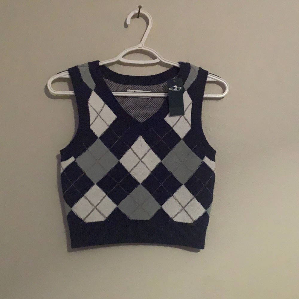 - Small Hollister blue and white sweater vest. New with tag.